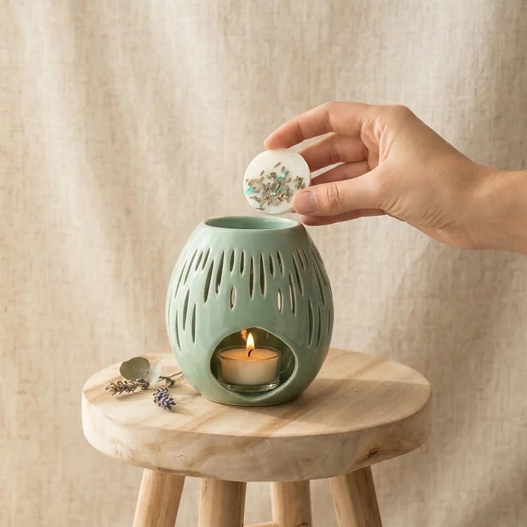 bruleur à fondant galet parfumé en  céramique vert d'eau