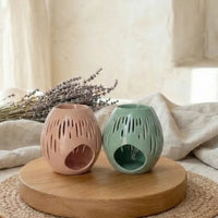 bruleur à fondant galet parfumé en  céramique vert ou terracotta